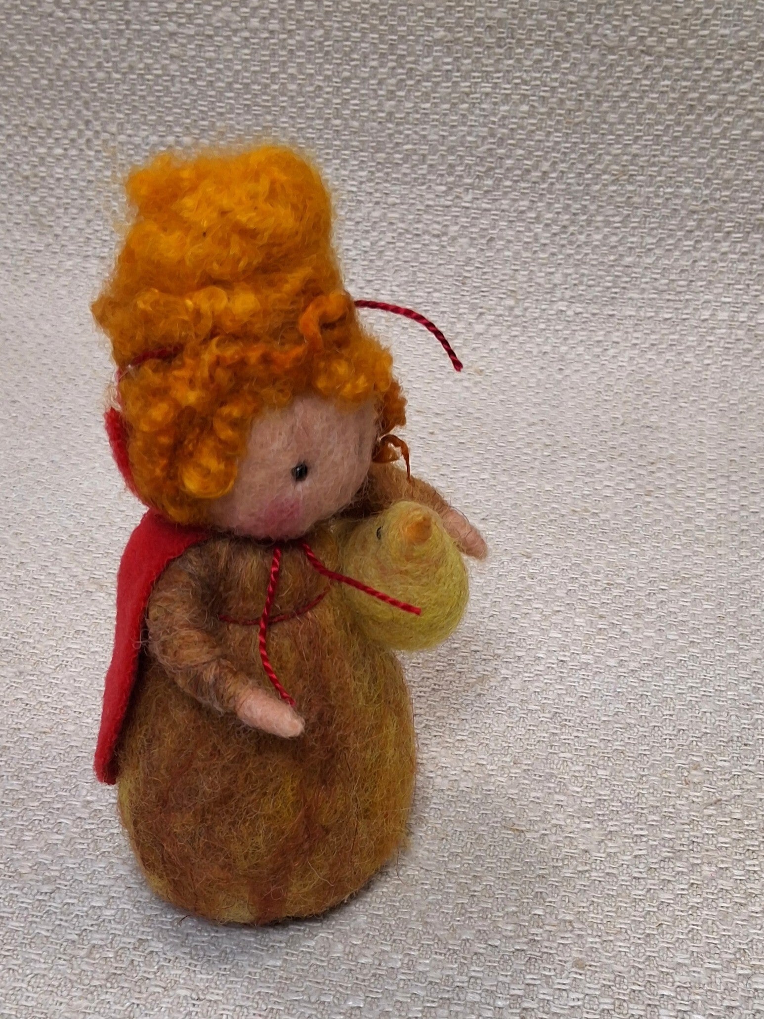 149. Naaldviltpopje met kuikentje