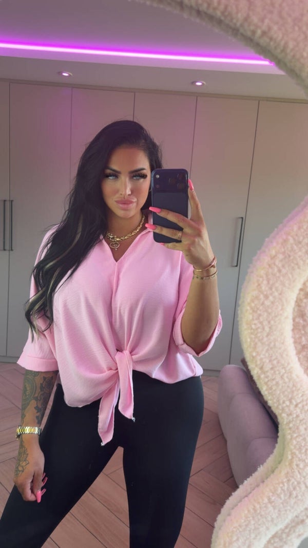 Roze knoop blouse