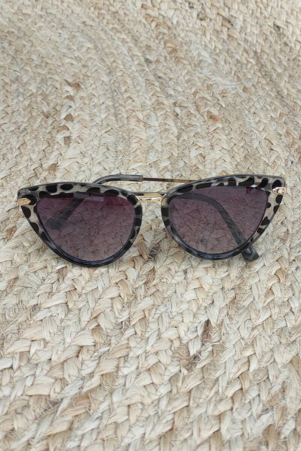 Sonnenbrille schwarz/lila/gold mit Fleckenmuster
