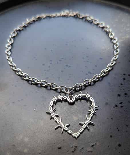 Spiked barbed wire heart pendant necklace