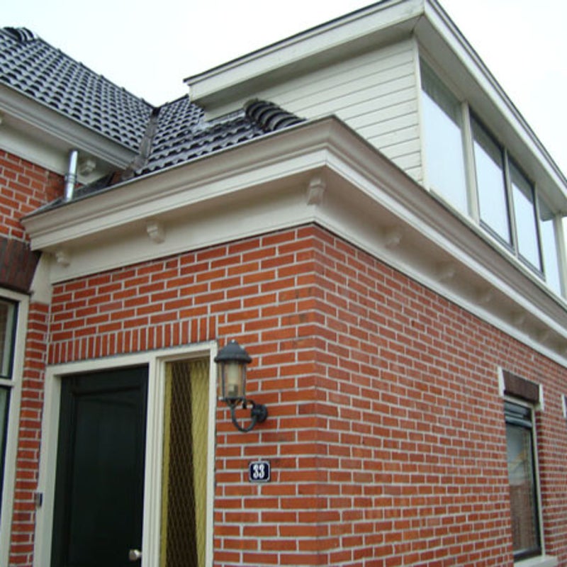 Dakgoot renovatie arbeiderswoning van voormalig oude melkfabriek Briltil