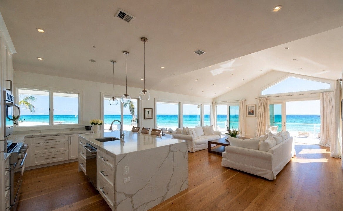 A cleaned and fresh looking beachside kitchen and lounge room