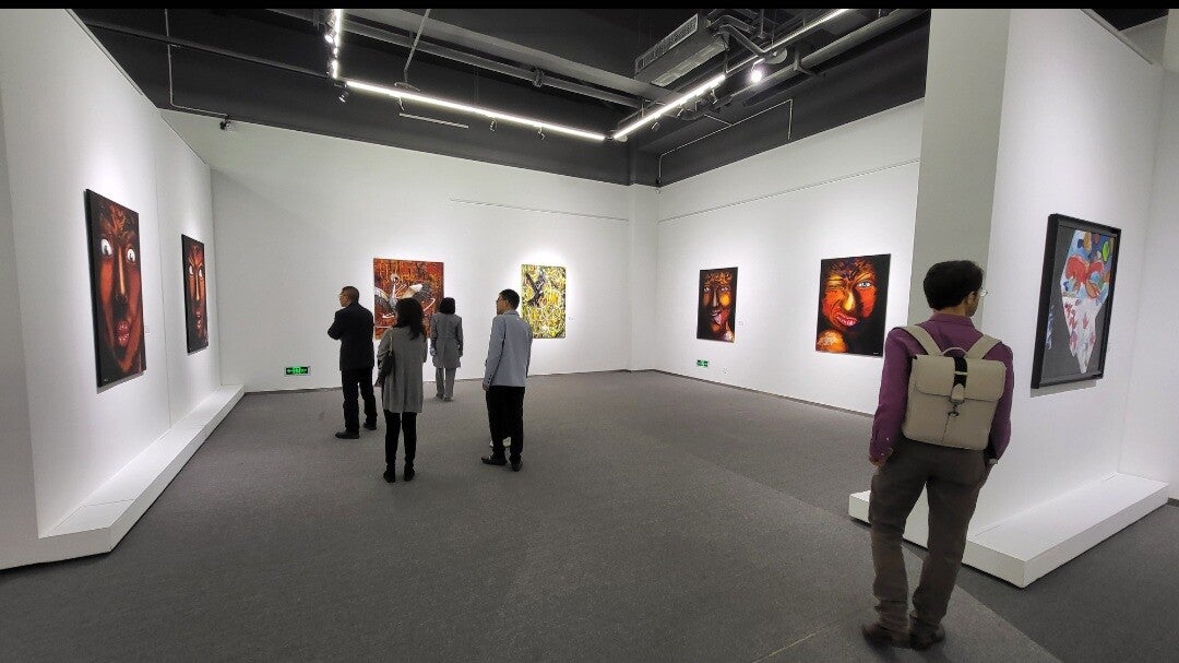 Visitors viewing paintings by Willem Vos at Hong Art Museum in Chongqing, China.
