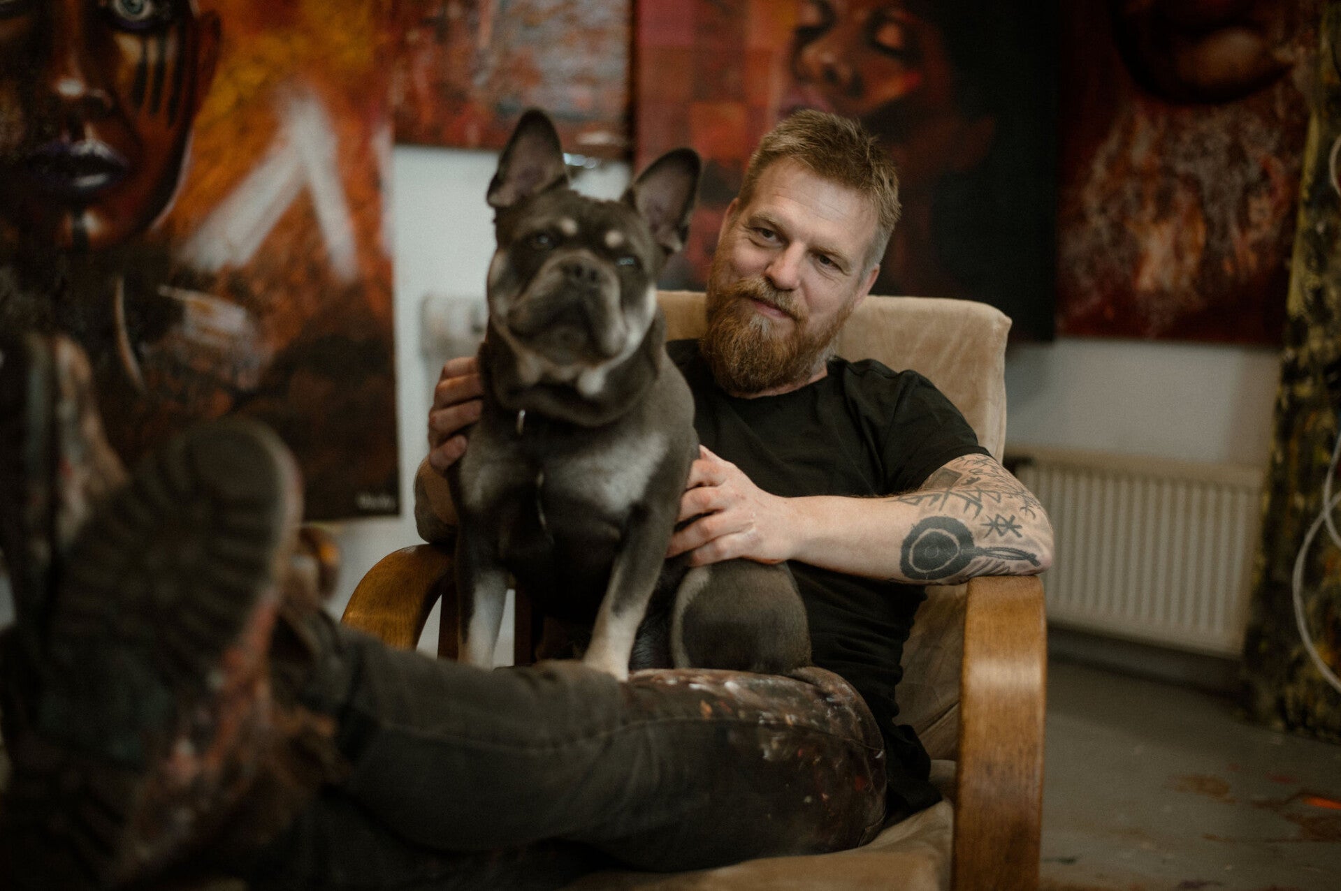 Dutch painter Willem Vos with his dog Muffin in his studio in Dwingeloo.