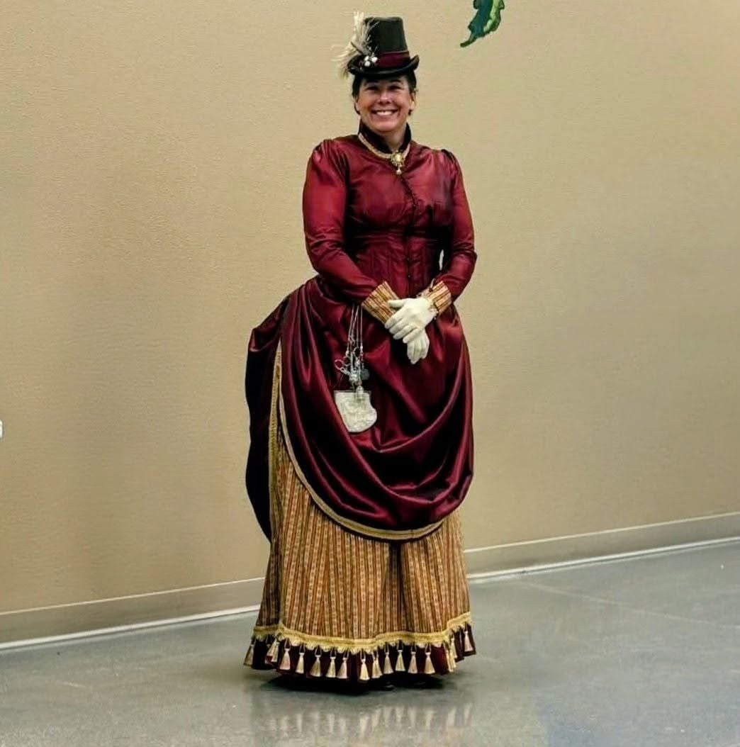 Indian Creek Historical Fashions owner Rayma Volkmer wearing authentic hand-sewn 19th-century Victorian attire.
