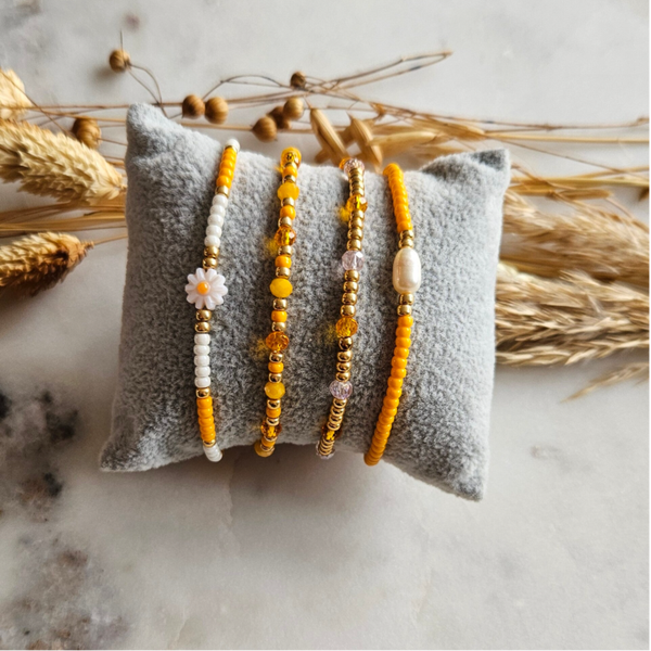 Armbanden set op elastiek (4 armbandjes) - Oranje/Bloem/Goud mix