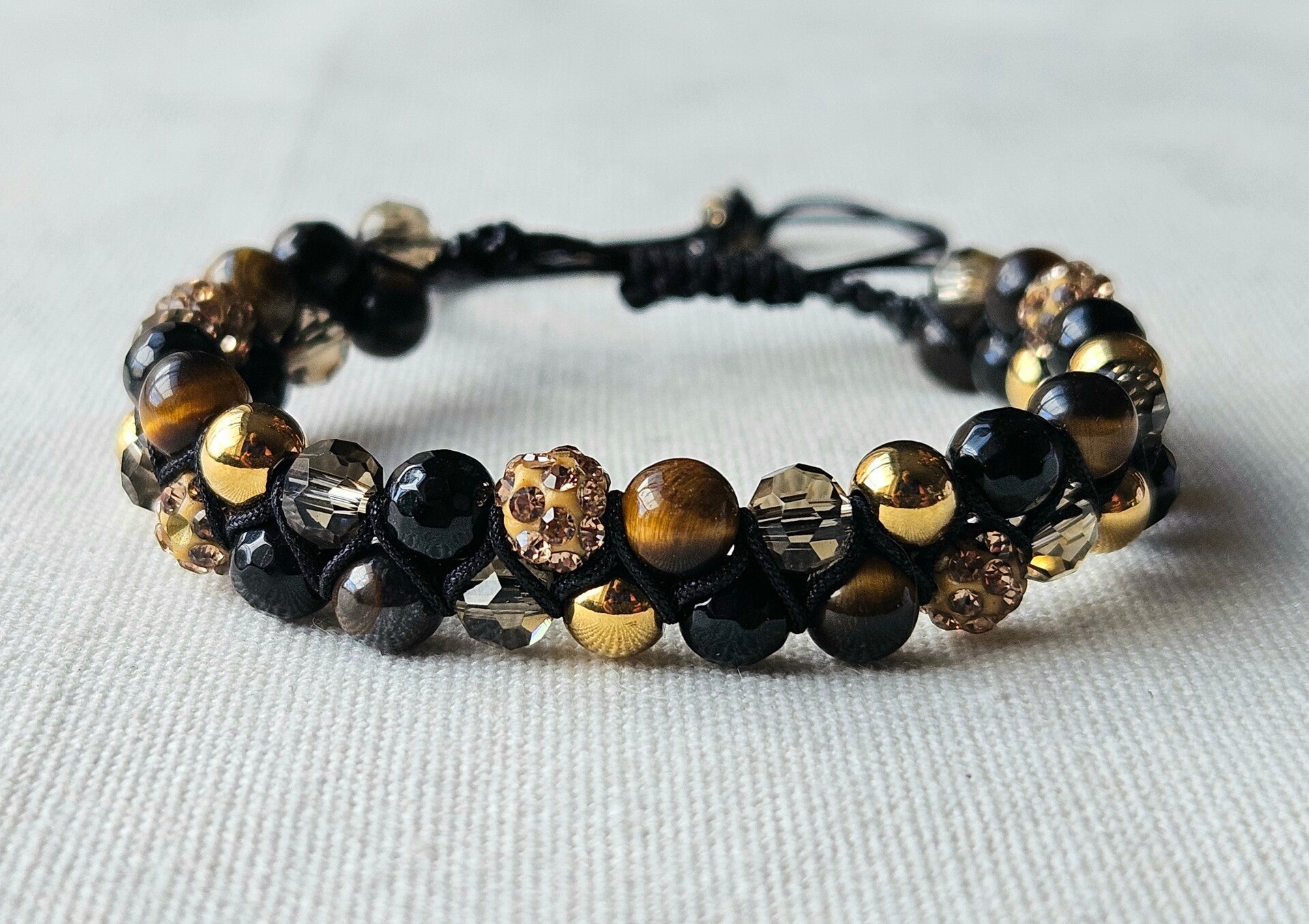 Beads by DEB handgevlochten armband met edelstenen- tigereye, glitter.
