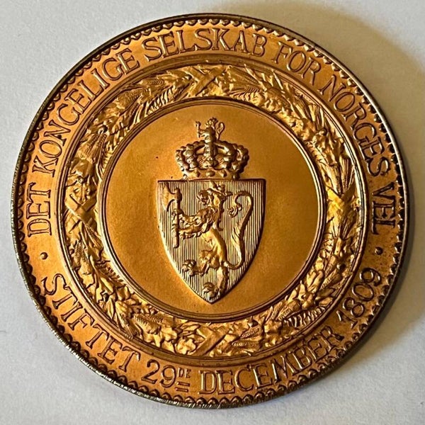 Det kongelige selskab for Norges vel - Haakon VII våpenskjold