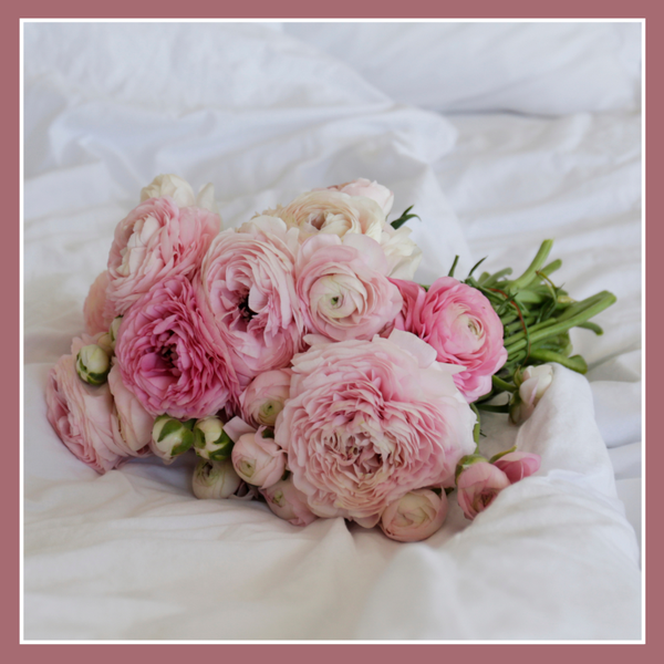 Wenskaart ranonkels op bed