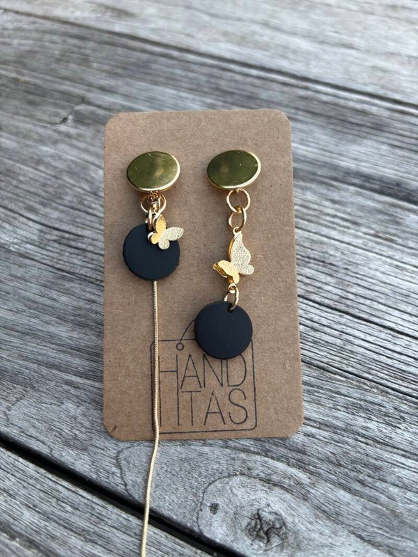 Goudkleurige stekers met zwart leren cirkels en goudkleurige vlinders