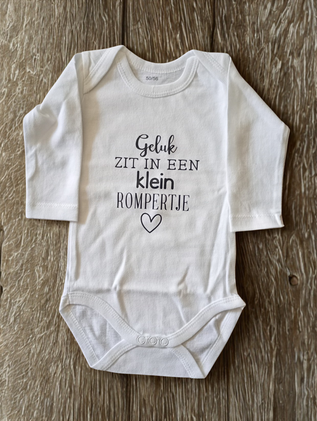 geluk zit in een klein rompertje