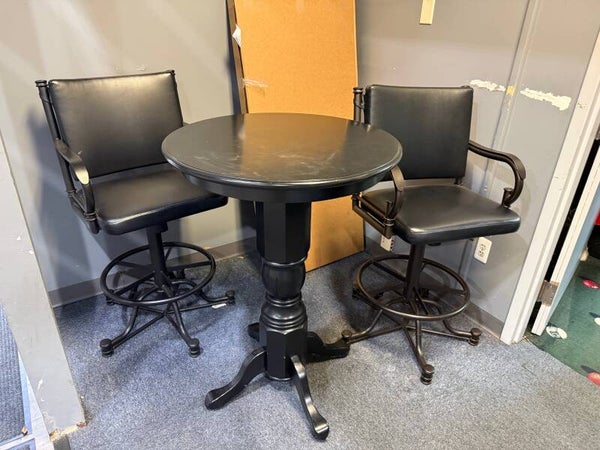 metal bar stools with black pub table