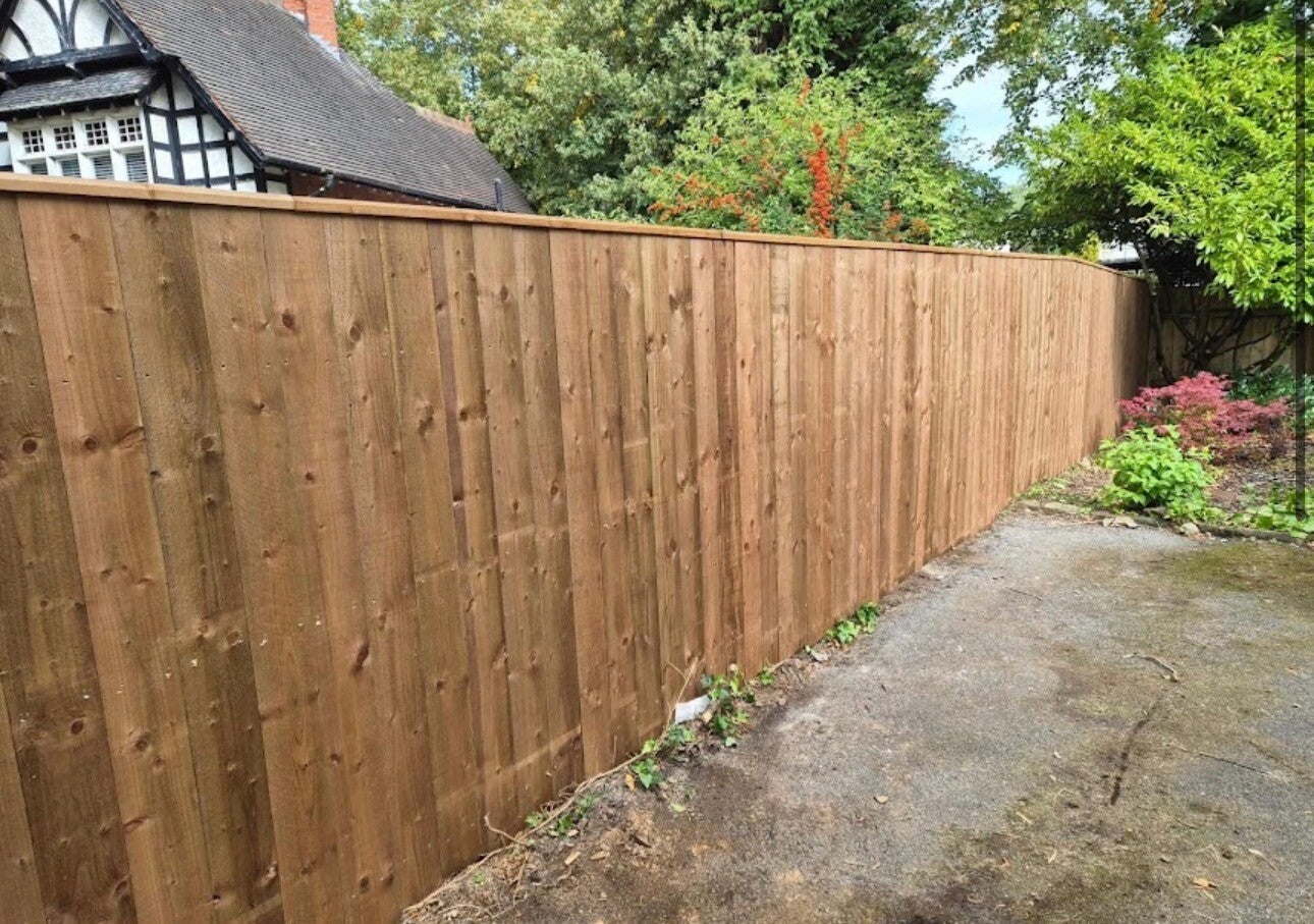 Tall timber feather edge closeboard fence installation in Chepstow by Heritage Trees & Landscapes⁠