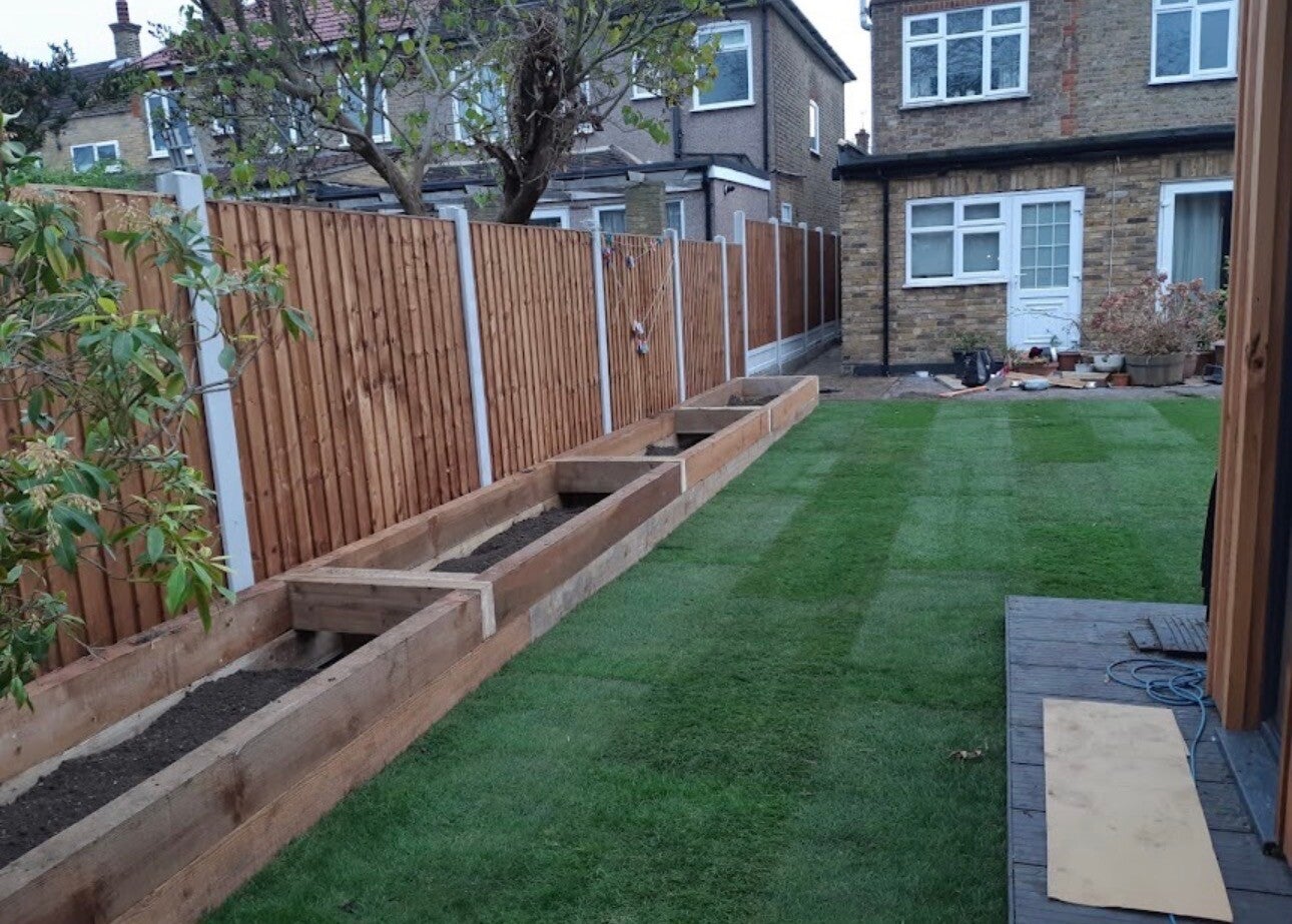 Concrete post fencing installation with raised timber sleeper beds in Chepstow⁠