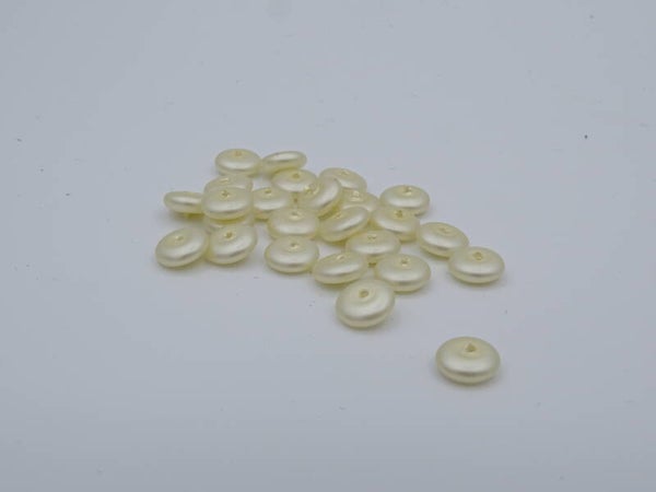 Tussen kralen creme/beige