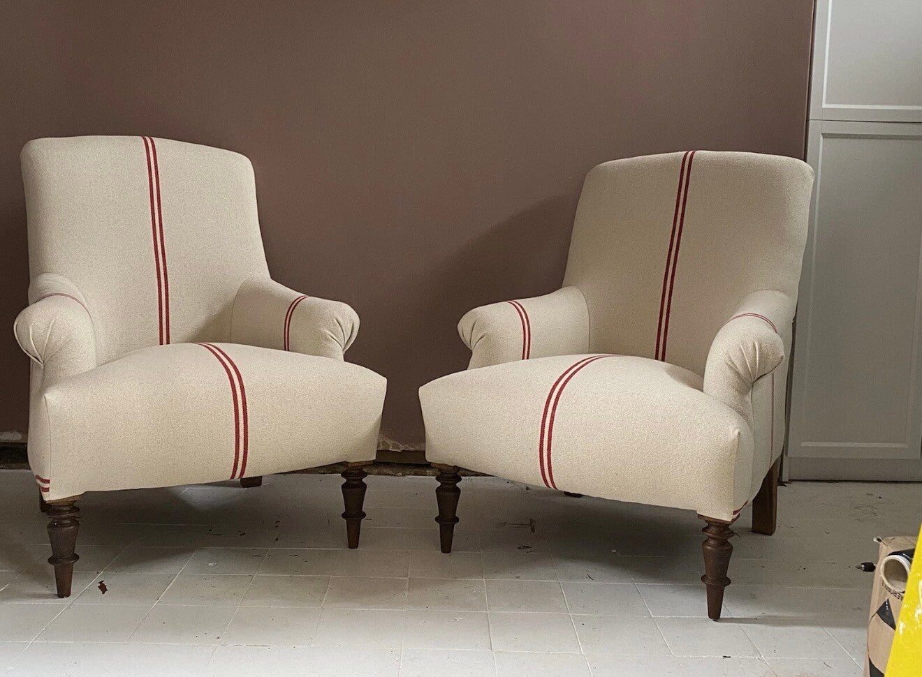 Pair of French Louis chairs in soft grain sacking red stripe