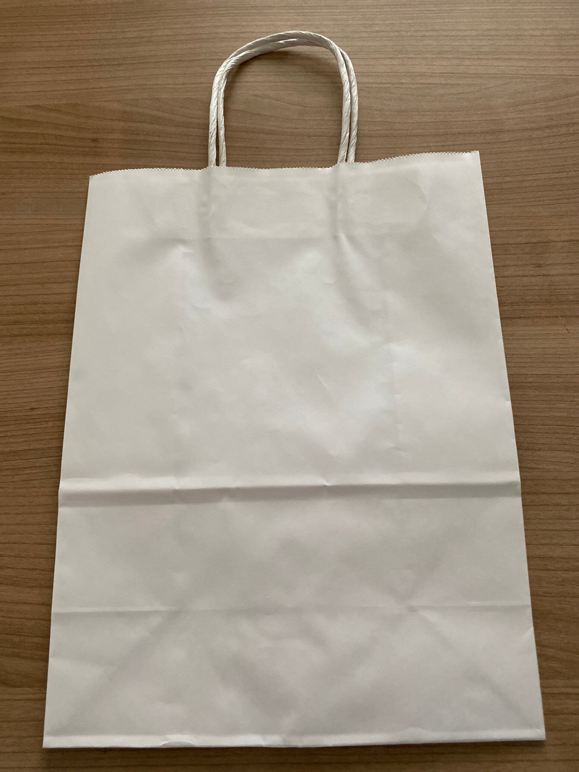 Grand sac en papier (pour le retrait sur place à Payerne)