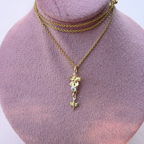 Gouden hanger bloem en duif