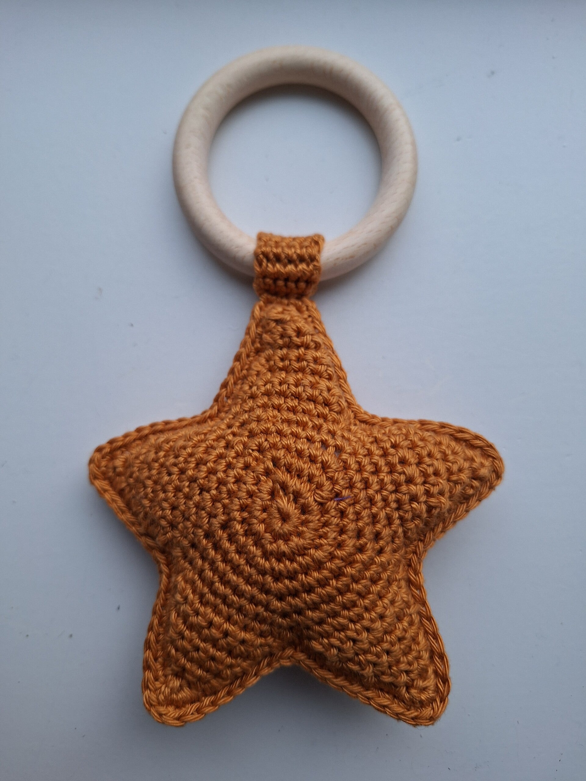 Bijtring ster donker oker