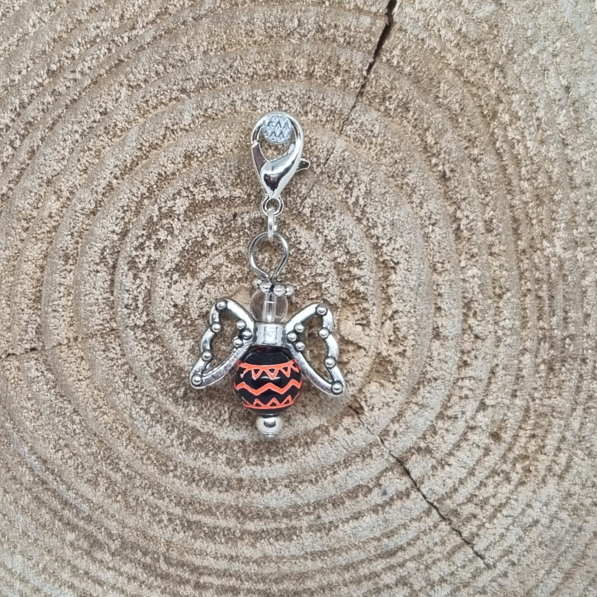 Geluksengel zwart/oranje roze