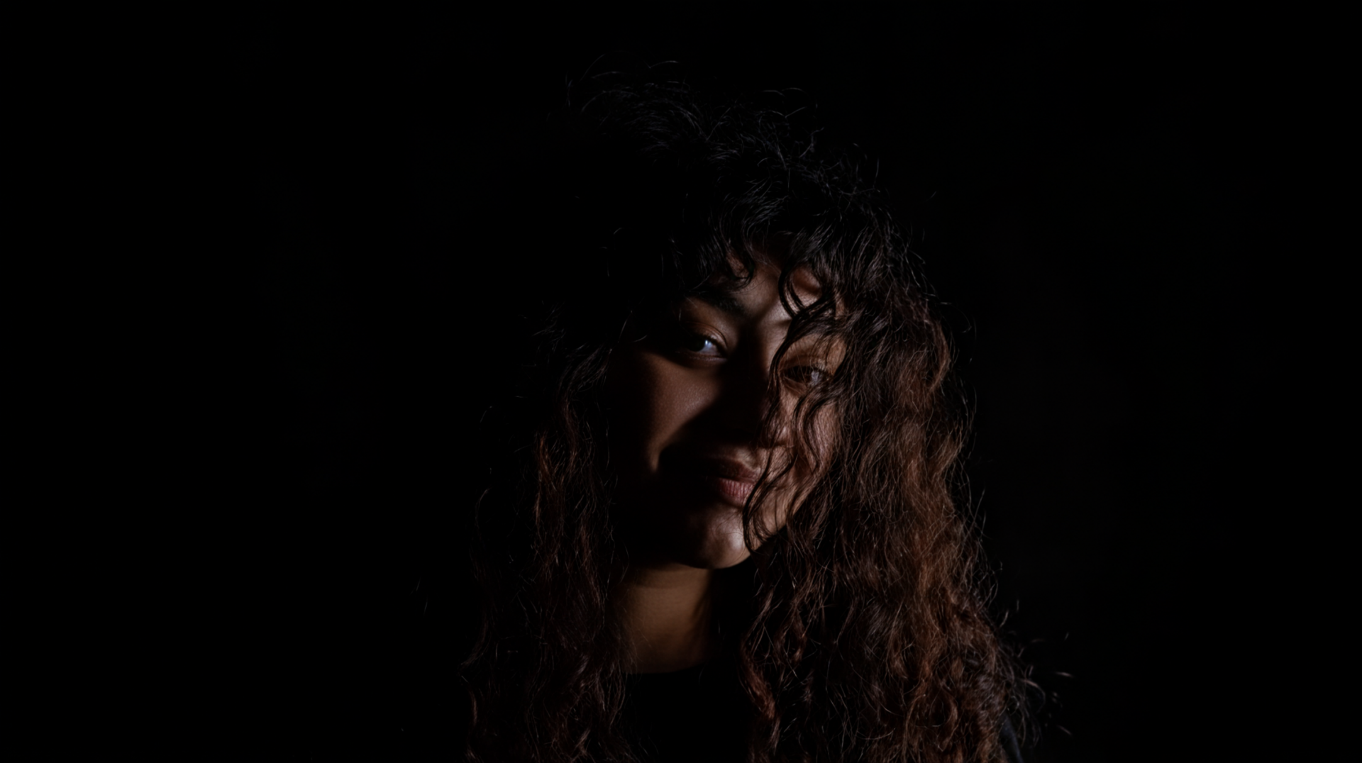 pr1ncesaurus_a_photo_a_person_with_long_curly_hair_backlit_by_08bf2a57-c2d3-448f-9cdf-87c57e194673_3-1-standard.png