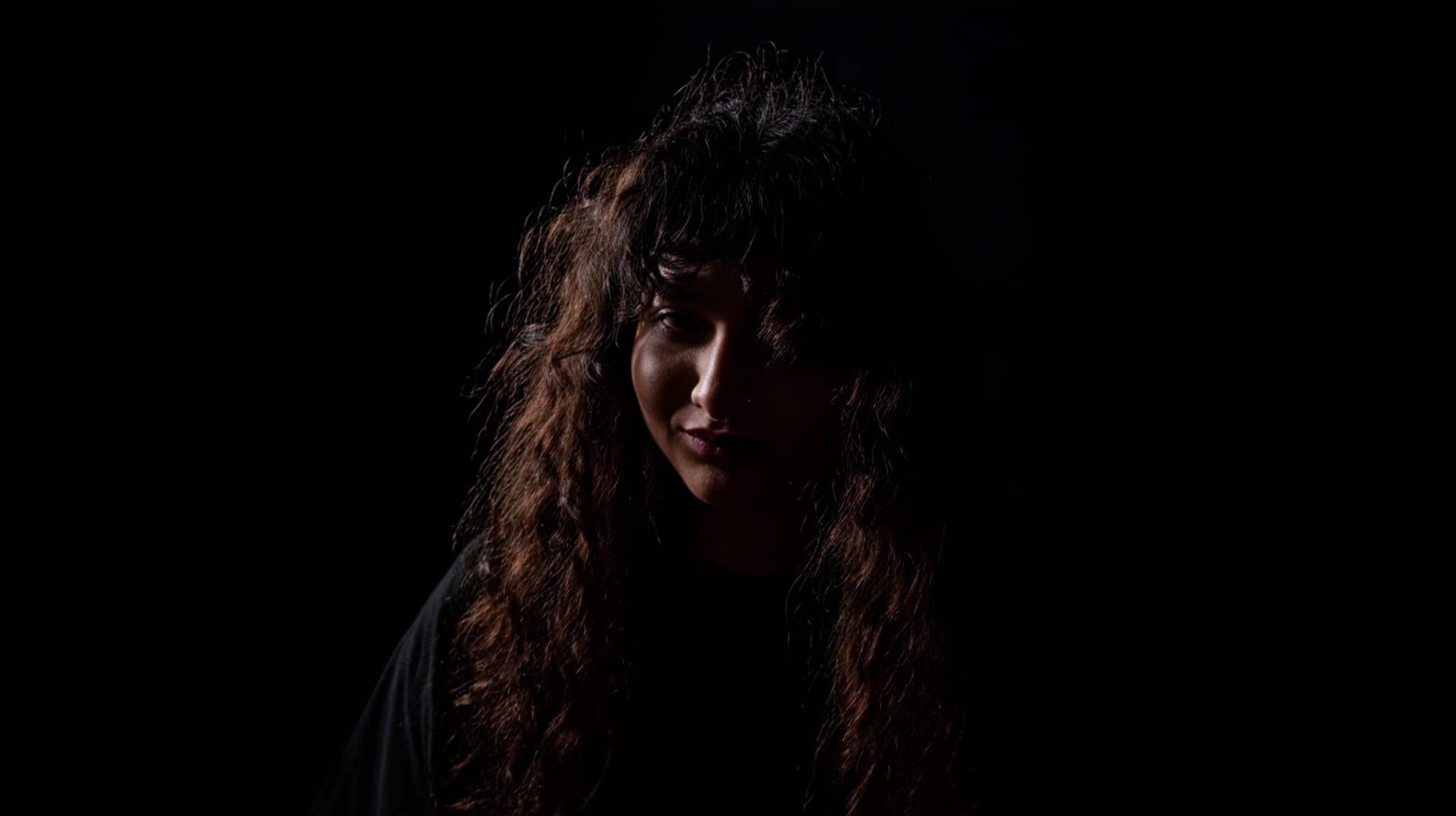 pr1ncesaurus_a_photo_a_person_with_long_curly_hair_backlit_by_093ca4cd-b178-4aa2-a467-8d6cf1780c1b_3-1-standard.png