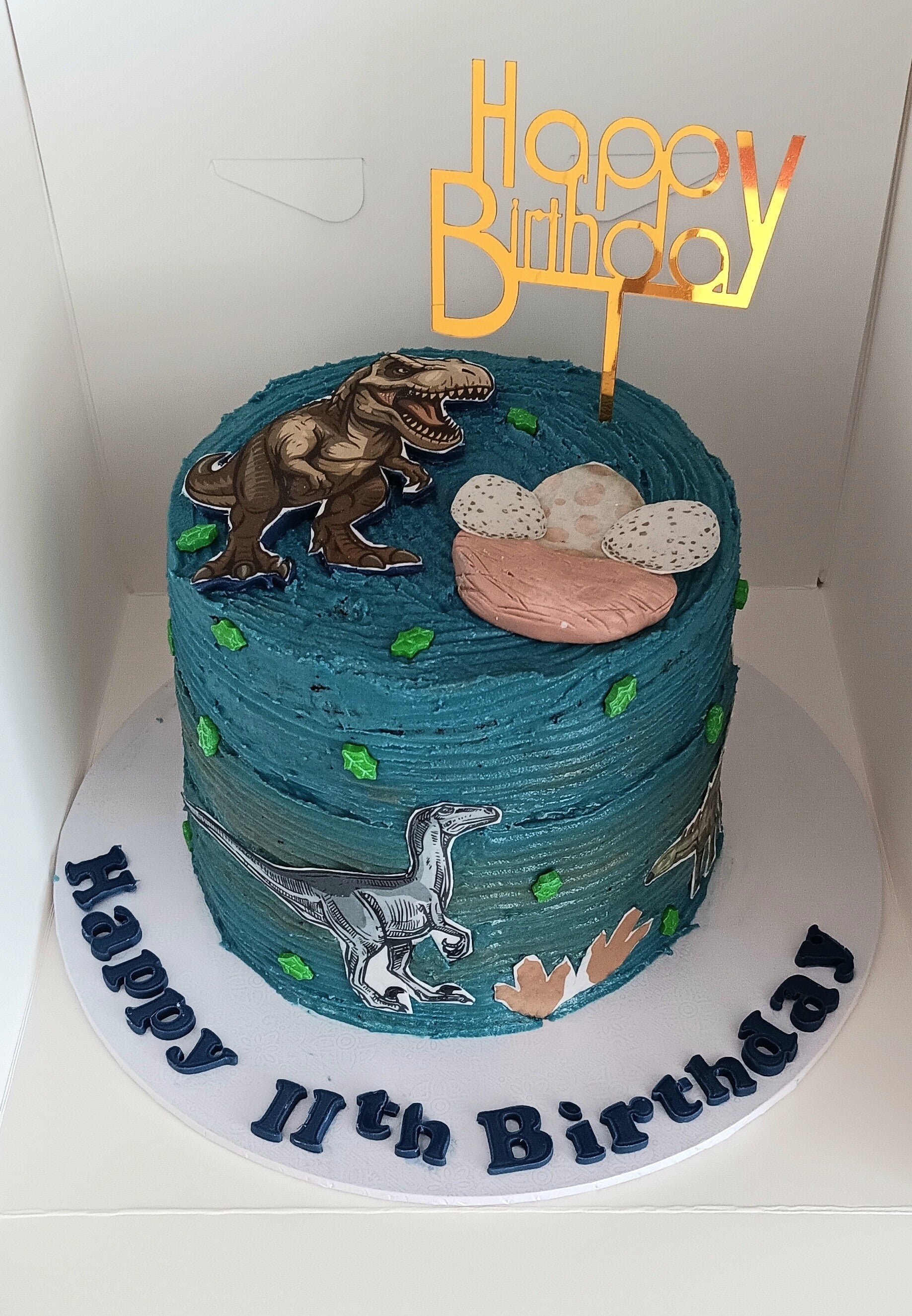Boys dinosaur themed birthday cake