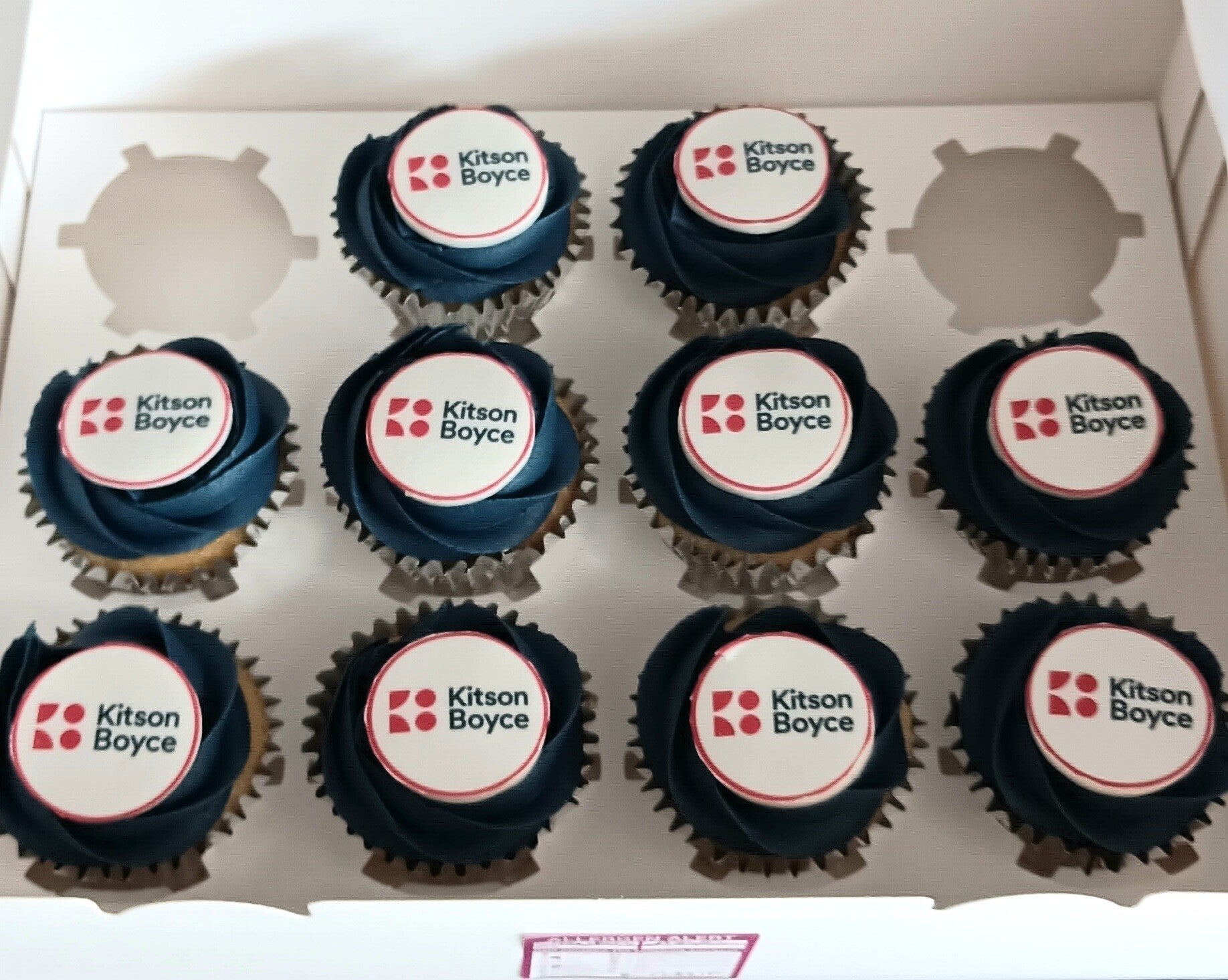 Blue corporate cupcakes with logo
