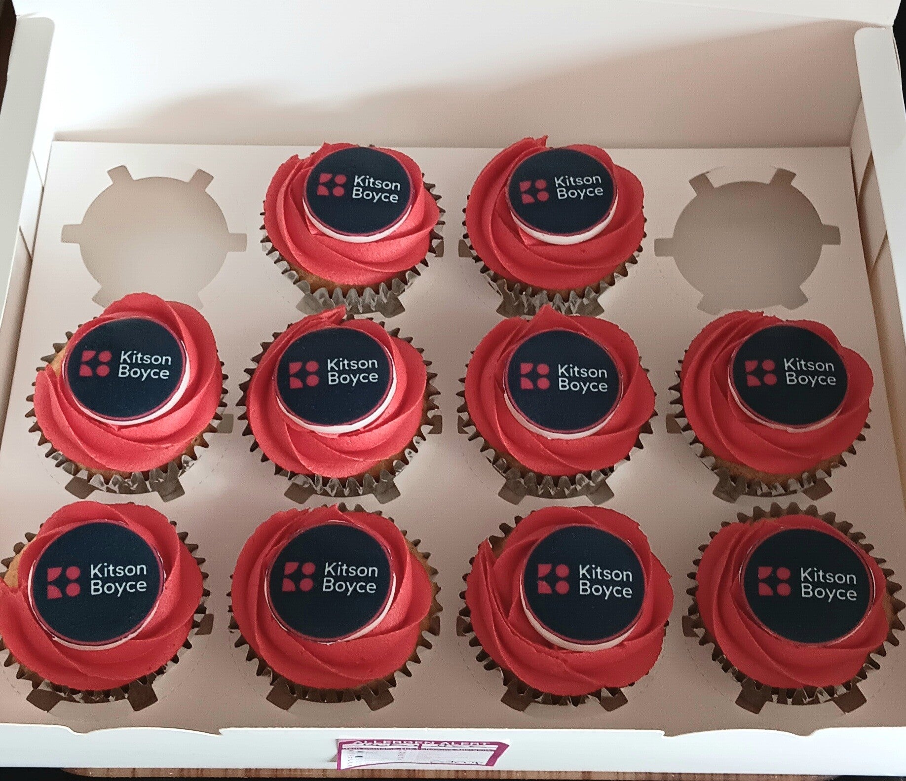 Red corporate cupcakes with own logo