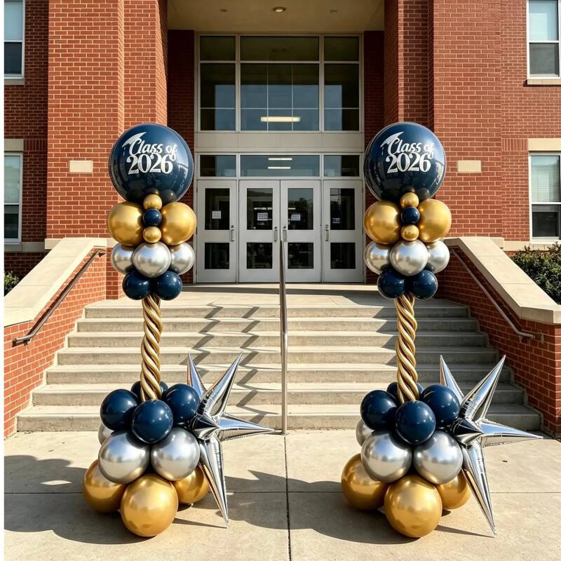 Navy, gold and silver balloon columns with star accents for a graduation celebration