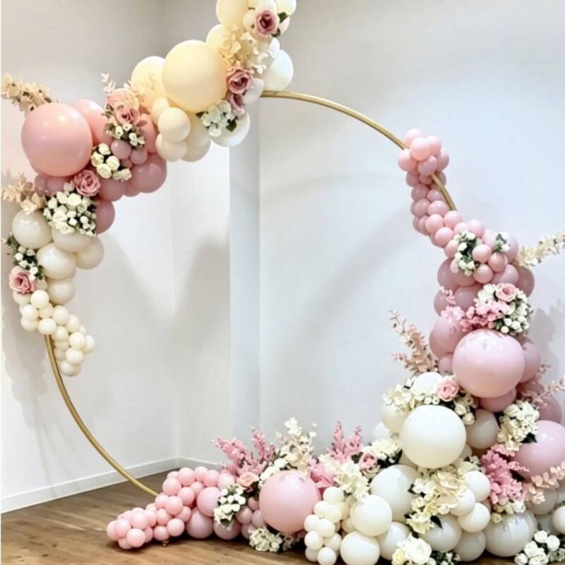 Blush pink, cream and white floral balloon hoop styled for a wedding