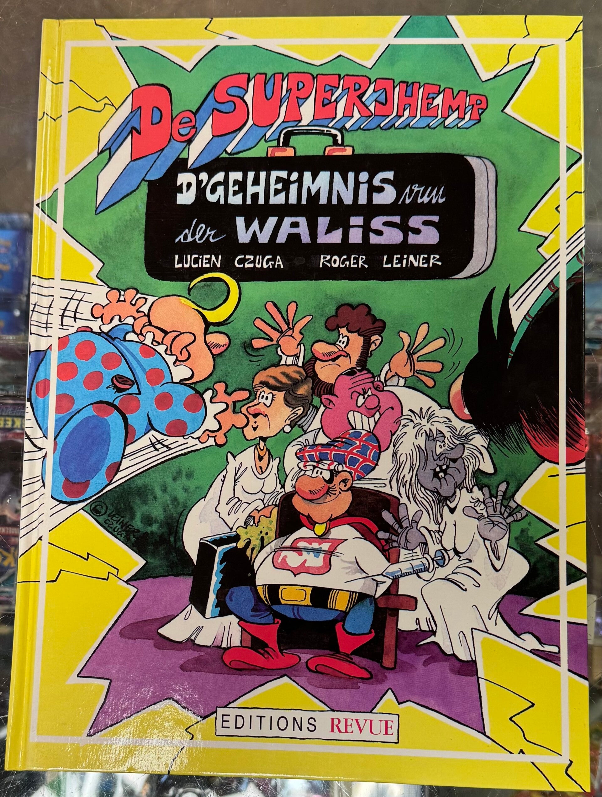 De Superjhemp - Geheimnis vun der Waliss - secret de la valise