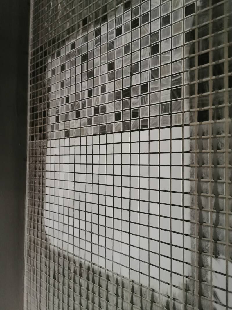 Soot damaged bathroom wall