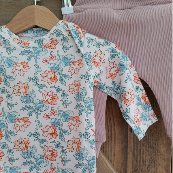 Setje oranje bloemen maat 68