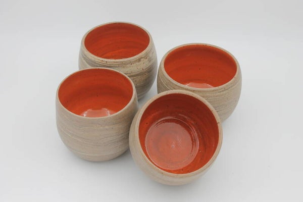 Ronde mok met oranje glazuur