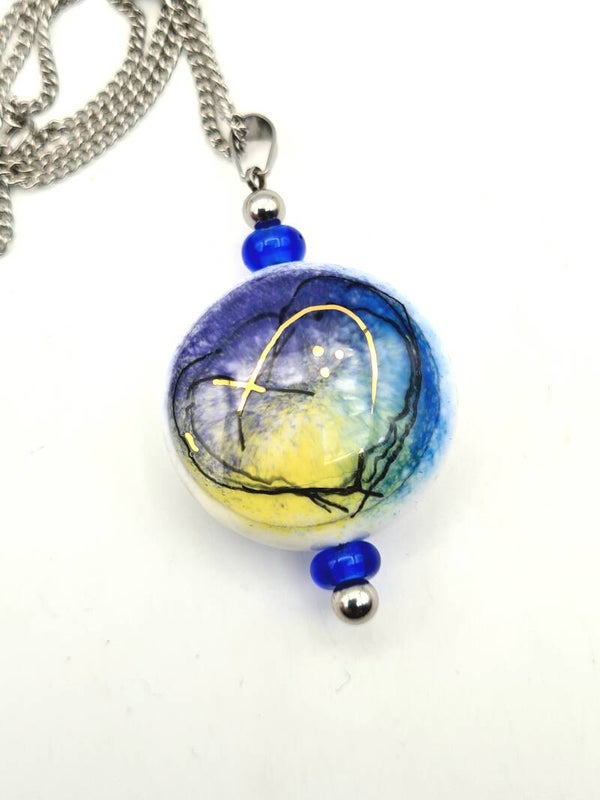 Pendant with gold accent