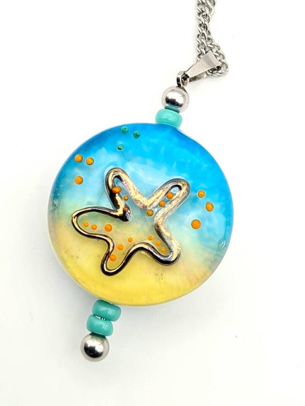 Pendant with gold accent