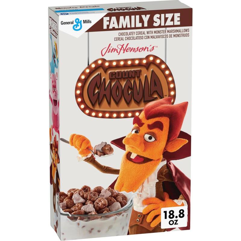 Puppet-style Count Chocula, Boo Berry, and Franken Berry cereal boxes in plush, fuzzy packaging.