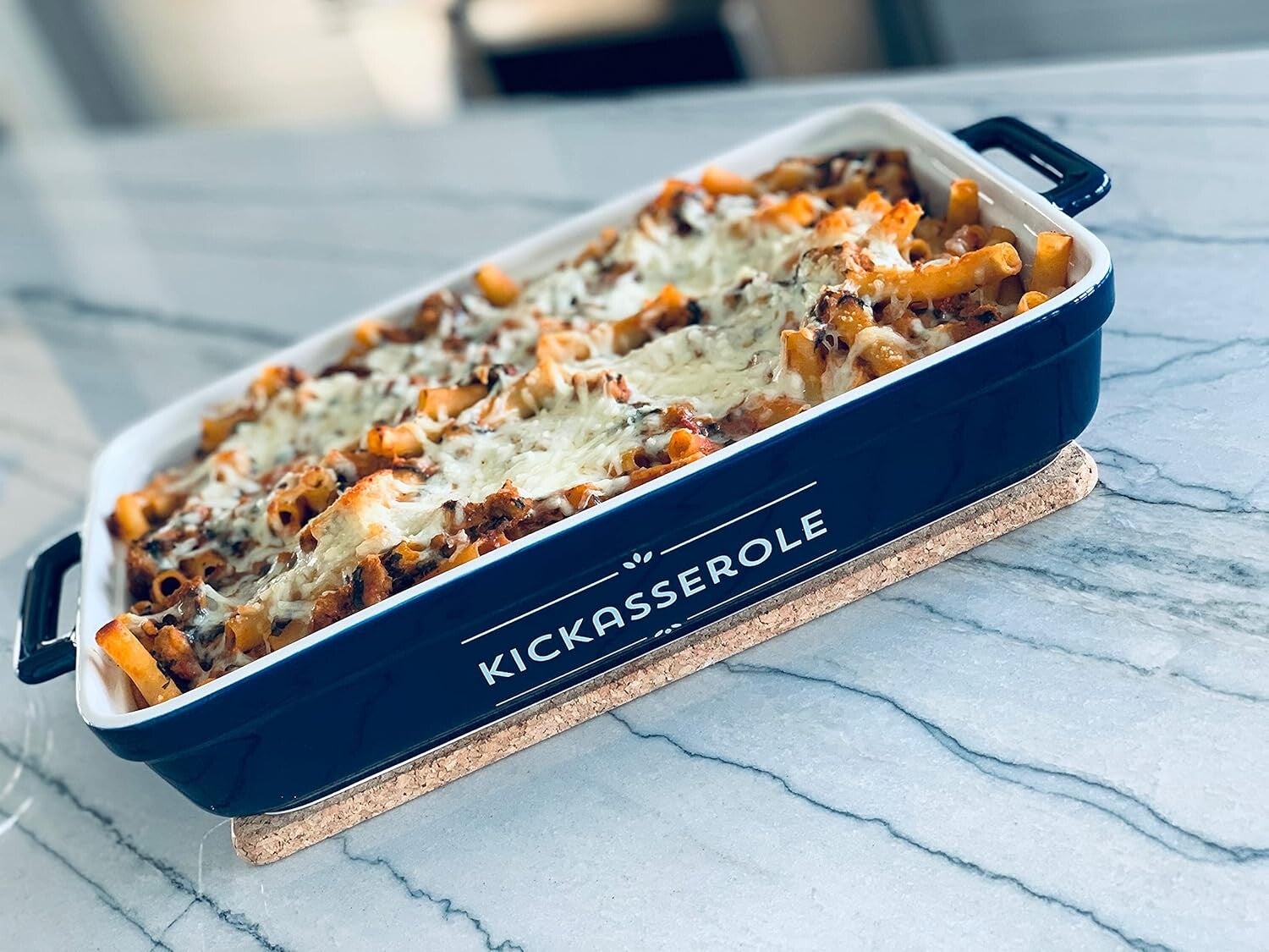 Kickassorole ceramic casserole dish with bold lettering on side, oven-safe, perfect for baking casseroles.