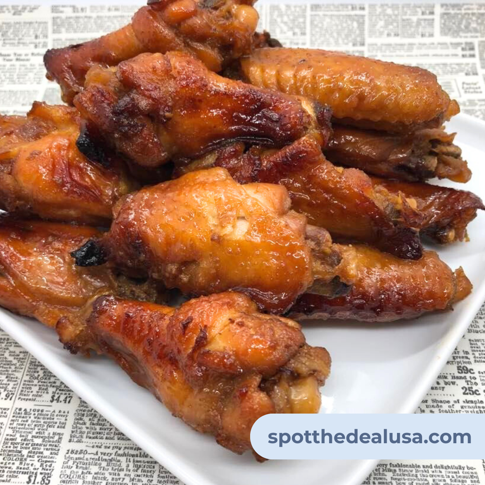 Homemade plate of Betty White’s famous chicken wings—golden brown, sticky, and served fresh on a white plate.