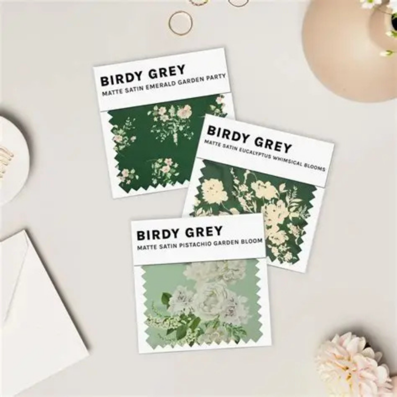 Three floral-inspired bridesmaid dress fabric swatches from Birdy Grey, ideal for planning a garden wedding theme.