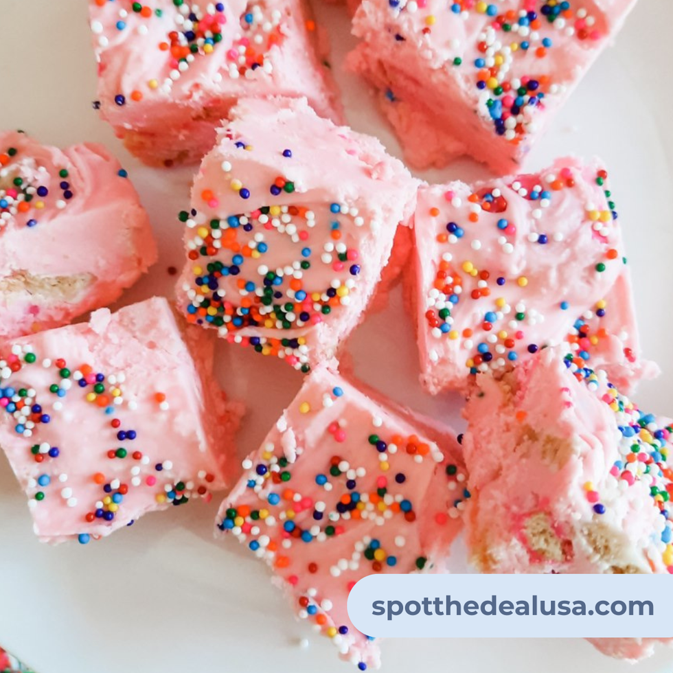 Bright pink fudge squares with rainbow sprinkles and circus cookie chunks