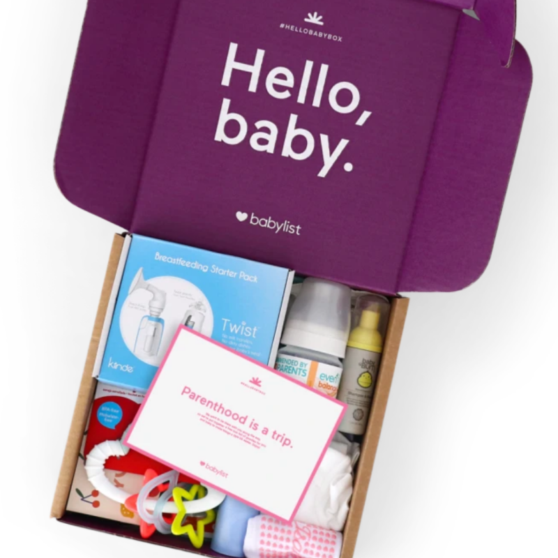 A Babylist Hello Baby Box filled with baby essentials, including bottles, wipes, and pacifiers.