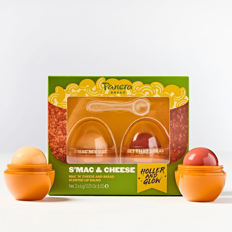 Two lip balm tubes labeled Mac N Cheese and Bread, part of the Panera x Holler and Glow Lip Balm Duo, photographed in fun packaging.