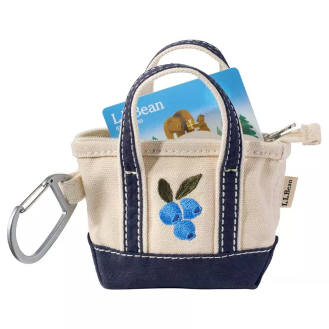 L.L.Bean Embroidered Micro Tote Bag featuring a blueberry embroidery design on durable natural canvas with navy trim, inspired by the iconic Boat and Tote style.