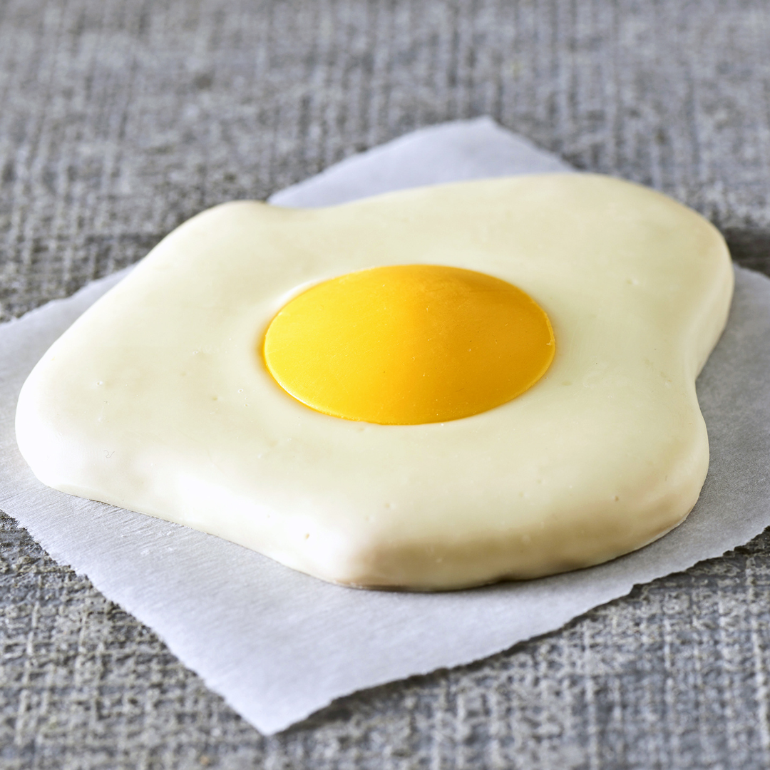 Soft sugar cookie topped with colorful egg-shaped icing, available for a limited time at Bruegger’s Bagels.
