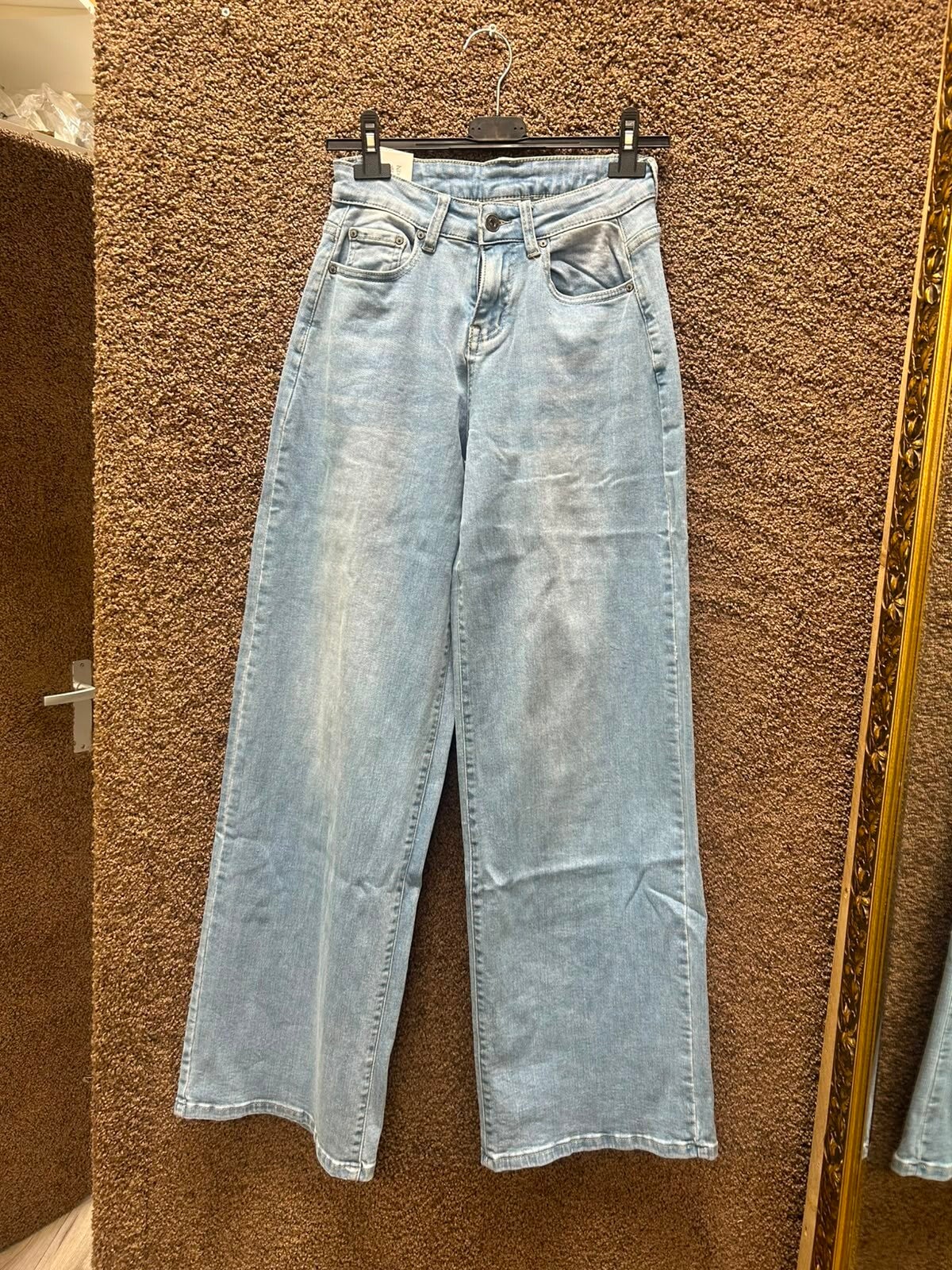 Spijkerbroek blauw met roze glitter zak