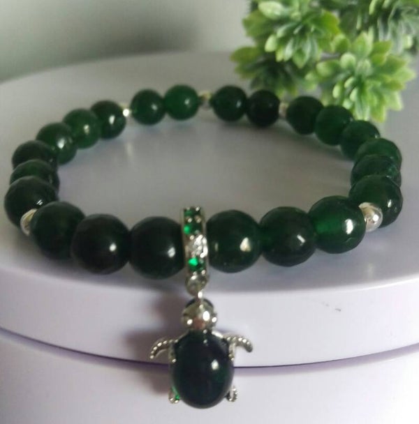 Faceted emerald beaded bracelet with green murano glass sterling silver turtle charm