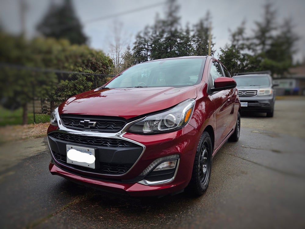 Chevrolet Spark parked in a Comox Valley driveway after a mobile detail