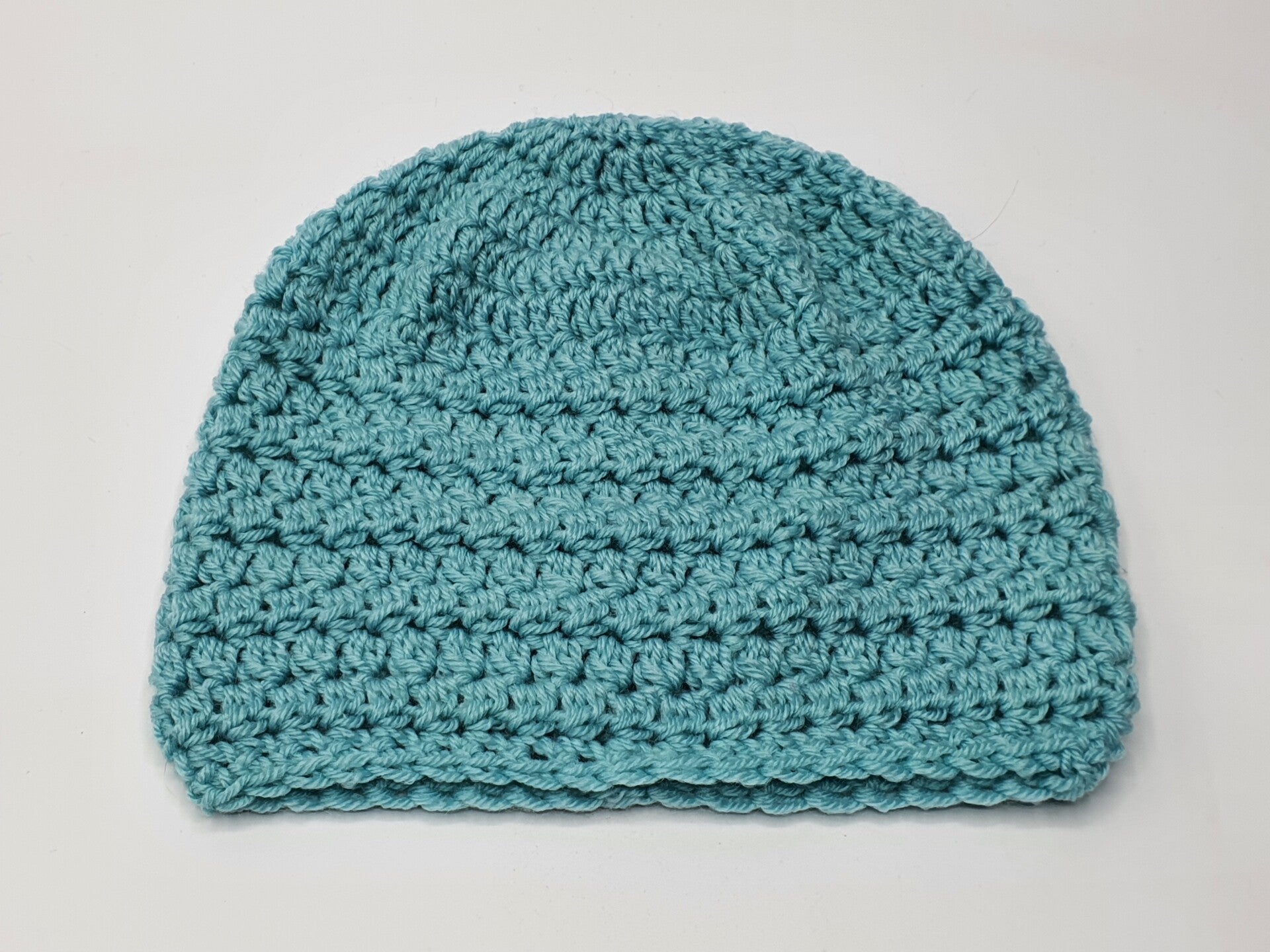 Turquoise babymutsje